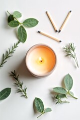 Candlelight Harmony: An aromatic candle burns gently amidst sprigs of rosemary, rose leaves and matches creating a soothing harmony of light and nature.