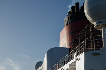 Red and black funnel of classic ocean liner cruise ship cruiseship Elizabeth Victoria against deep...