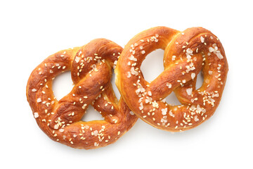Tasty pretzels with salt isolated on white, top view