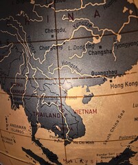 Close-up of a vintage globe focusing on Southeast Asia