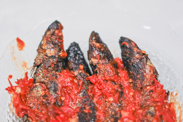 pindang or boiled fish coated in spicy chili sauce