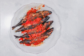 pindang or boiled fish coated in spicy chili sauce
