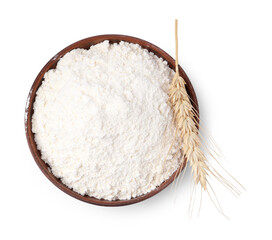 Wheat flour in bowl and spike on white background, top view