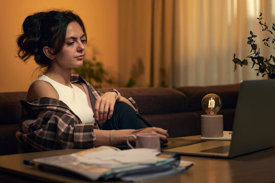 beautiful professional female retoucher woman working at home workspace using digital graphic tablet and laptop