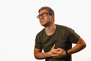 Man showing signs of discomfort while holding his chest