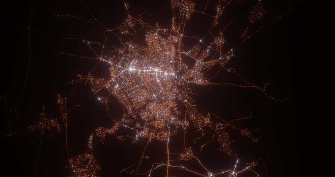 Taraz (Kazakhstan) aerial view at night. Top view on city from space. Camera is zooming in, rotating clockwise