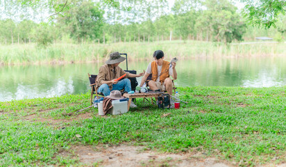 Charging Phone with Solar Power at Lakeside Picnic