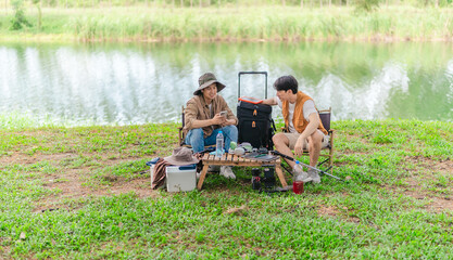 Charging Phone with Solar Power at Lakeside Picnic