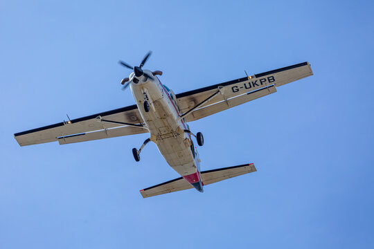 Aircraft in flight, Image shows aircraft G-UKPB a Cessna 208B Grand Caravan flying overhead coming into land