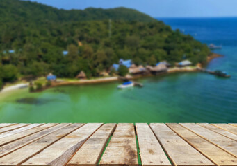Wooden table top on the beach or sea.Party on the beach  sunshine time concept.For montage product display or design key visual layout.View of copy space.