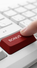 Close-up of finger pressing red keyboard button labeled "BONUS", showcasing online reward concept.  Suggests reward, achievement, or digital bonus