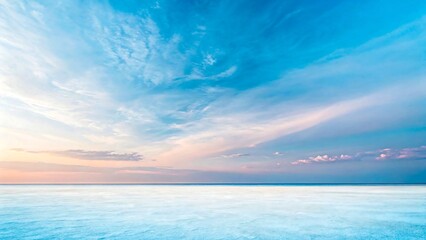 Fototapeta premium Peaceful ocean horizon with pastel sky and soft clouds during serene sunrise or sunset 