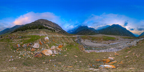 Full 360 panorama of dramatic mountain range over a peaceful valley in Kyrgyzstan, equirectangular...