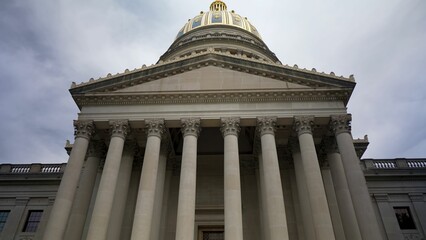 The West Virginia state capitol in Charleston boasts grand columns and a stunning dome, drawing visitors with its historical and architectural significance.