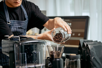 A young Asian male barista, dressed in a striped apron, skillfully creates beautiful latte art in a cozy, modern cafe, professional coffee equipment and takeaway cups.