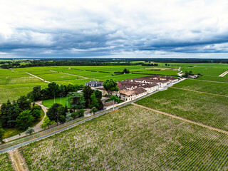Chateau Pontet-Canet Vineyard and grape fields around Pauillac and Gironde Estuary from a drone,...