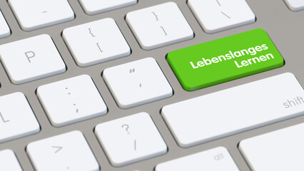 Taste auf Tastatur mit Schriftzug „Lebenslanges Lernen“ als Konzept