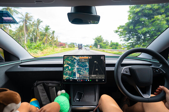 Business woman drive EV car use smart navigator travel trip