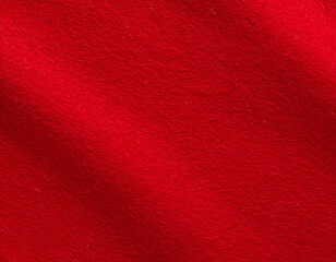 Fototapeta premium Vibrant red felt fabric with subtle texture and soft folds.