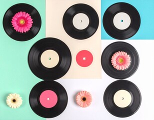 Retro background with vinyl records and flowers