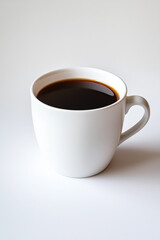 Obraz premium White coffee cup with a brown liquid in it