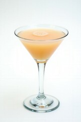 Golden Elixir: A refreshing cocktail presented in a stemmed glass, showcasing the tantalizing golden hue of the expertly mixed concoction.