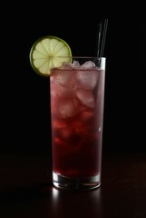 Refreshing Berry Cocktail: A tall, elegant glass filled with a vibrant, ruby-red berry cocktail, garnished with a slice of lime and served with elegant black straws.