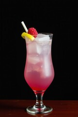 Raspberry Bliss Cocktail: A vibrant cocktail, elegantly presented, features a blend of refreshing ice and a lively raspberry, complemented by a subtle slice of lemon.