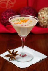 Festive Cocktail Delight: A sophisticated cocktail garnished with citrus zest and a star anise, perfect for seasonal celebrations, embodying the spirit of joy and indulgence.