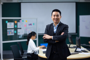 Portrait happy business man :  executive business Asian male. Portrait of handsome confident man in formal suit looking at camera