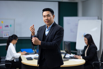 Portrait happy business man :  executive business Asian male. Portrait of handsome confident man in formal suit looking at camera