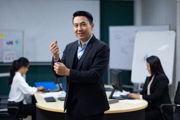 Portrait happy business man :  executive business Asian male. Portrait of handsome confident man in formal suit looking at camera