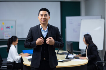 Portrait happy business man :  executive business Asian male. Portrait of handsome confident man in formal suit looking at camera