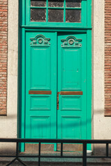 Bright and vivid building exteriors in colorful city. Mosaic tiles, vibrant facades, doors, balconies and decorative details of Abanotubani's sulfur baths in charming Tbilisi old town, Georgia
