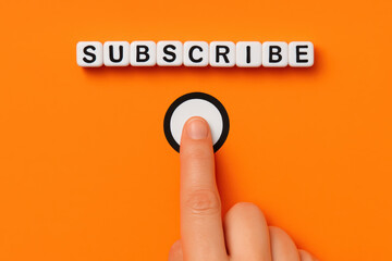 Engaging with a subscription concept a human presses a button symbolizing connection and digital interaction