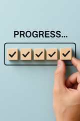Steady advancement is symbolized by the sequential placement marked cubes within a progress bar reflecting achievement planning and completion