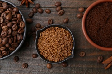 Different types of instant coffee, beans and spices on wooden table, flat lay