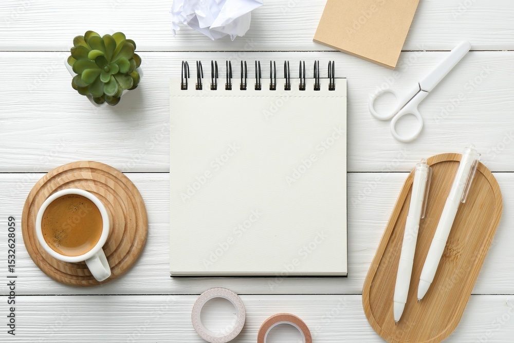 Aufkleber flat lay composition with open blank notebook on white wooden table