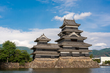 Beautiful of the evening light cast upon Matsumoto Castle, also known as the Crow Castle  is landmark and beloved tourist destination in Matsumoto City, Nagano Prefecture, Japan.