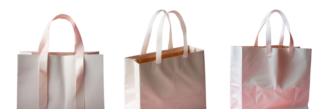 Close-up of a large light paper shopping bag with pink ribbon handles isolated on a transparent background with a soft pink backdrop highlighting its texture and shape.