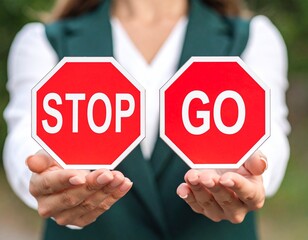 Outdoor worker holding stop and go sign. Hand hold traffic or road sign.