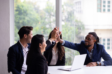 Business team hands together : Unity and teamwork. Company employee celebrate after finishing successful project. Successful people giving each other high five in meeting