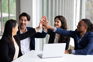 Business team hands together : Unity and teamwork. Company employee celebrate after finishing successful project. Successful people giving each other high five in meeting