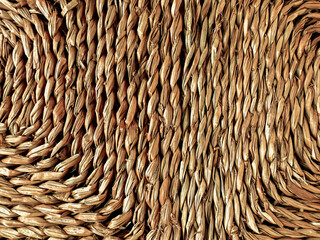 A fragment of a woven straw texture. Abstract background