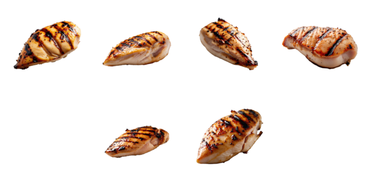 Grilled chicken breast pieces with char marks arranged on a transparent background with transparent areas showcasing different angles and orientations of the meat.