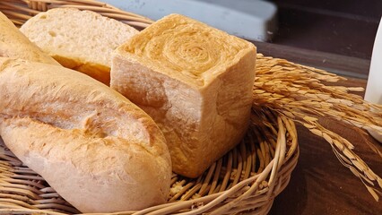Shokupan bread and baguette in basket.