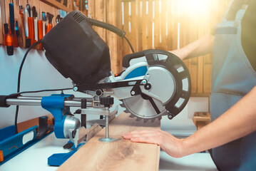 Miter saw while working on flooring panels