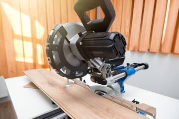 Miter saw while working on flooring panels