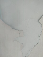 A wall with visible dirt and stains, caused by moisture or mold growth.