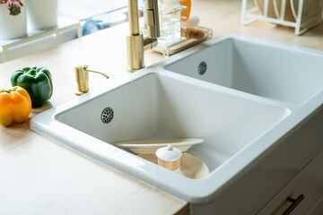 Dirty dishes in the sink. Ecodishwashing Brush.
